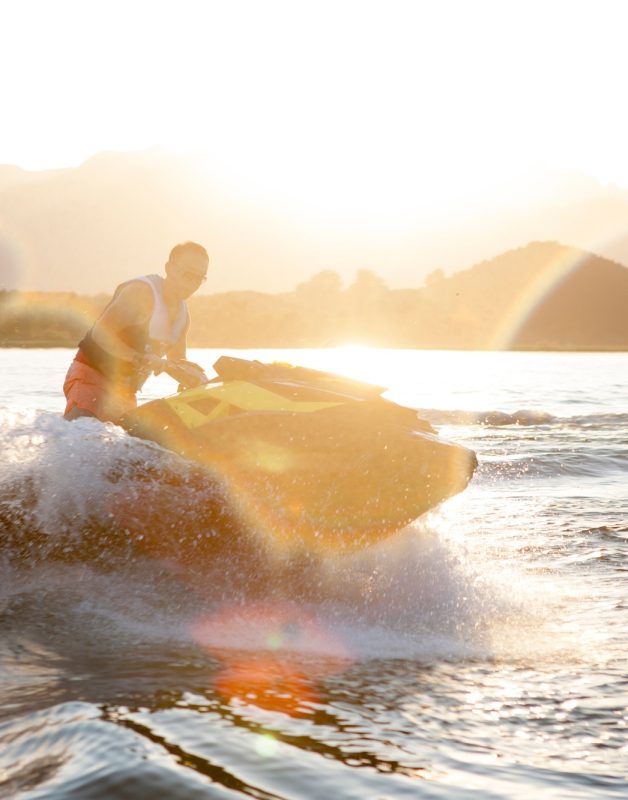 Man riding jet ski on lake, Beijing, China